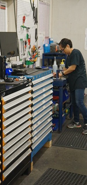 Woman and toolboxes photo of woman and toolboxes